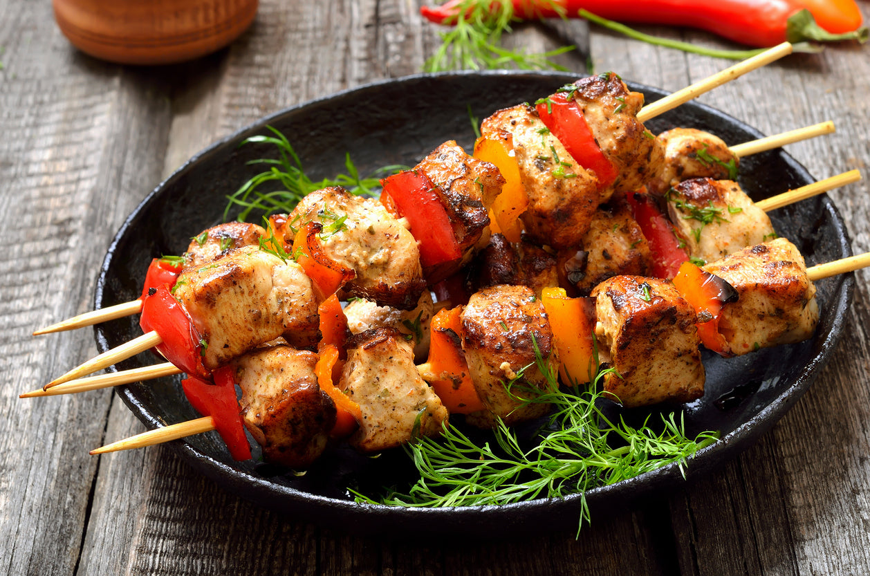 Chicken skewers stacked with roasted bell peppers