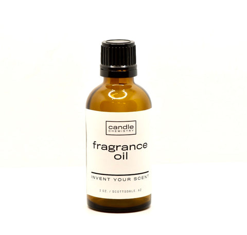 Custom fragrance oil in amber 2oz bottle and black cap