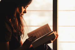 A woman reading a book.