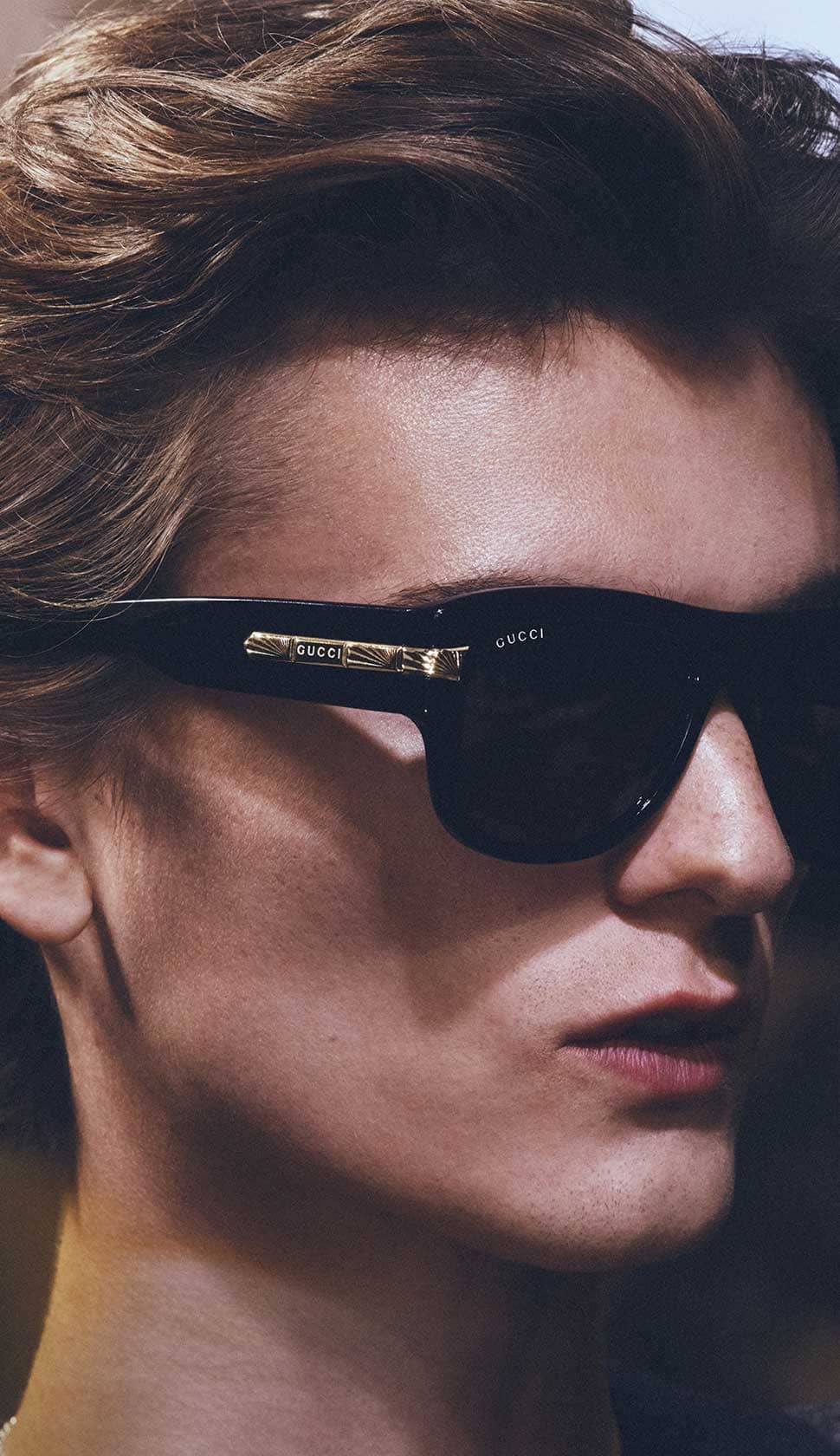 Gucci sunglasses mask design with light metal frame.