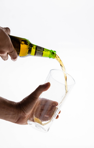 Beer Being Poured Into Insulated Pint Glass