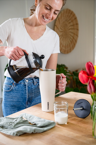 Woman Making Iced Coffee in Corkcicle Insulated Tumbler