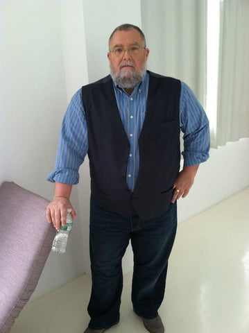 Wearing a dress shirt and vest for filming.