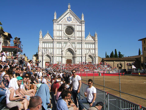 The church of Santa Croce with the bleachers filled with the red neighborhood