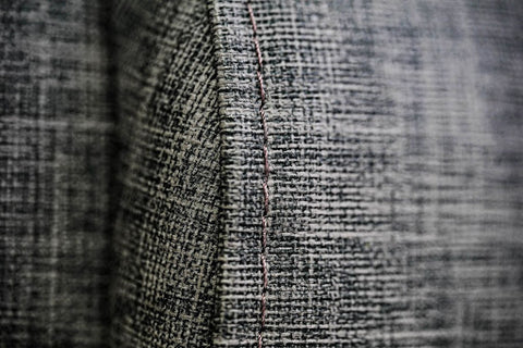 Grey sofa fabric and stitching details