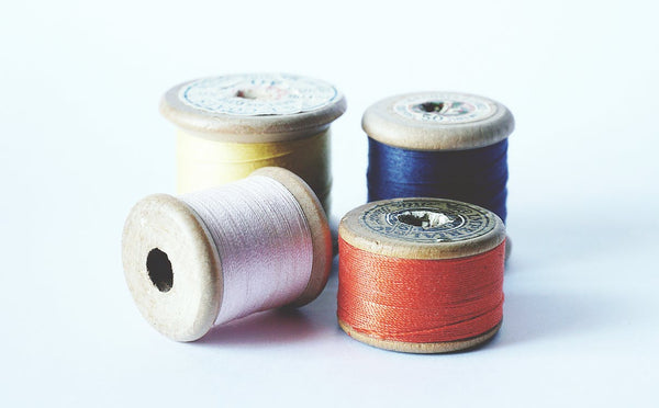 Four thread spools