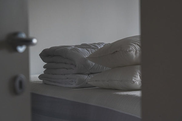 Pillows and duvets on top of the bed