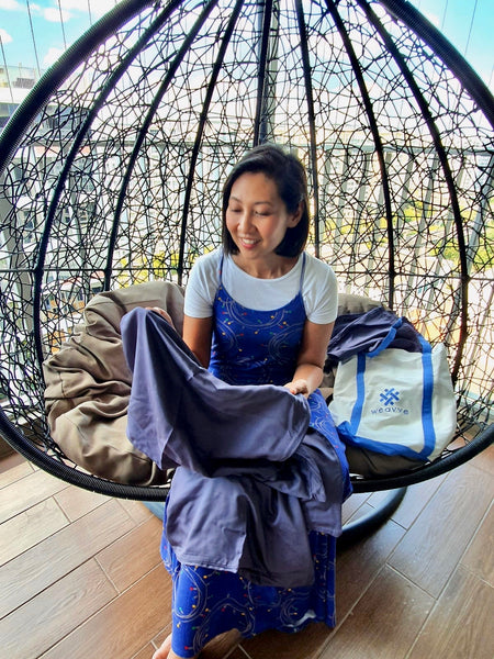 Sharon Ismail with Weavve Home Lyocell Tencel Bed Sheets in Dark Blue.