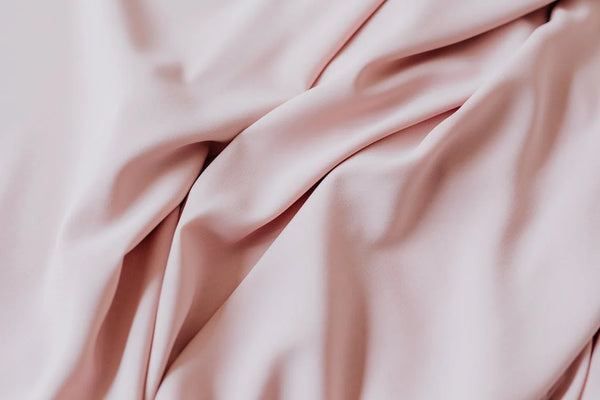 Winkle-free pink bed sheets