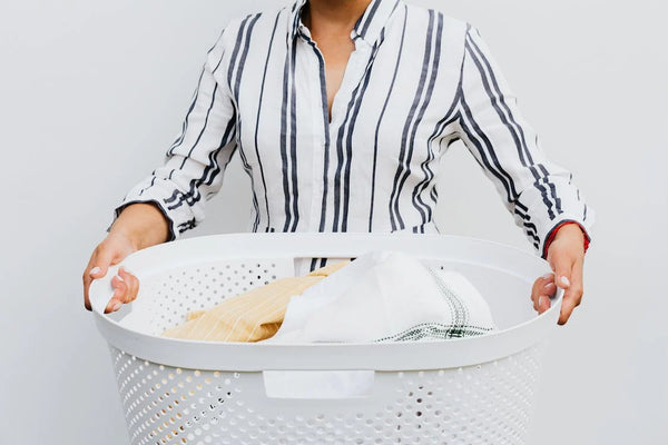 Woman holding laundry basket