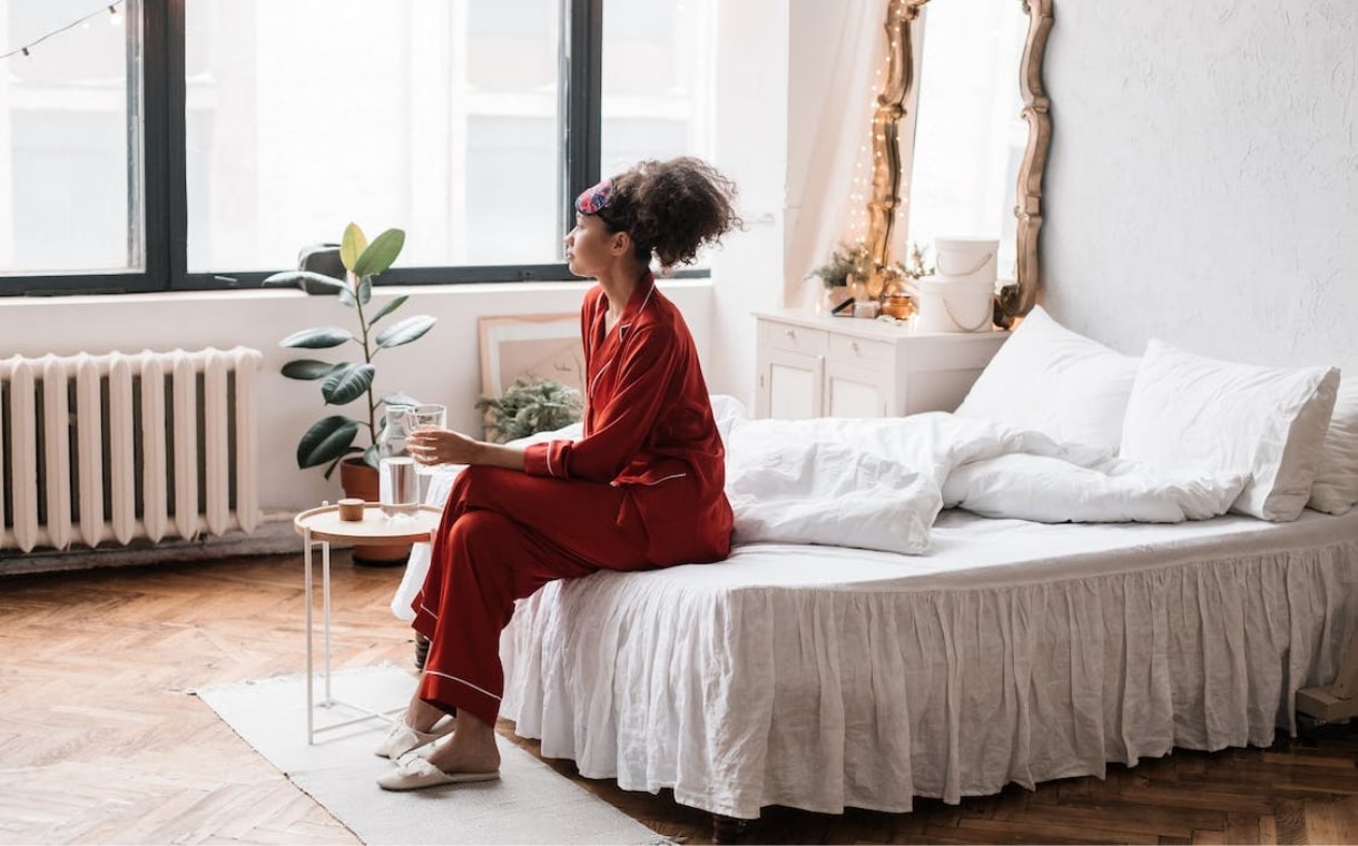 a person sitting on a bed