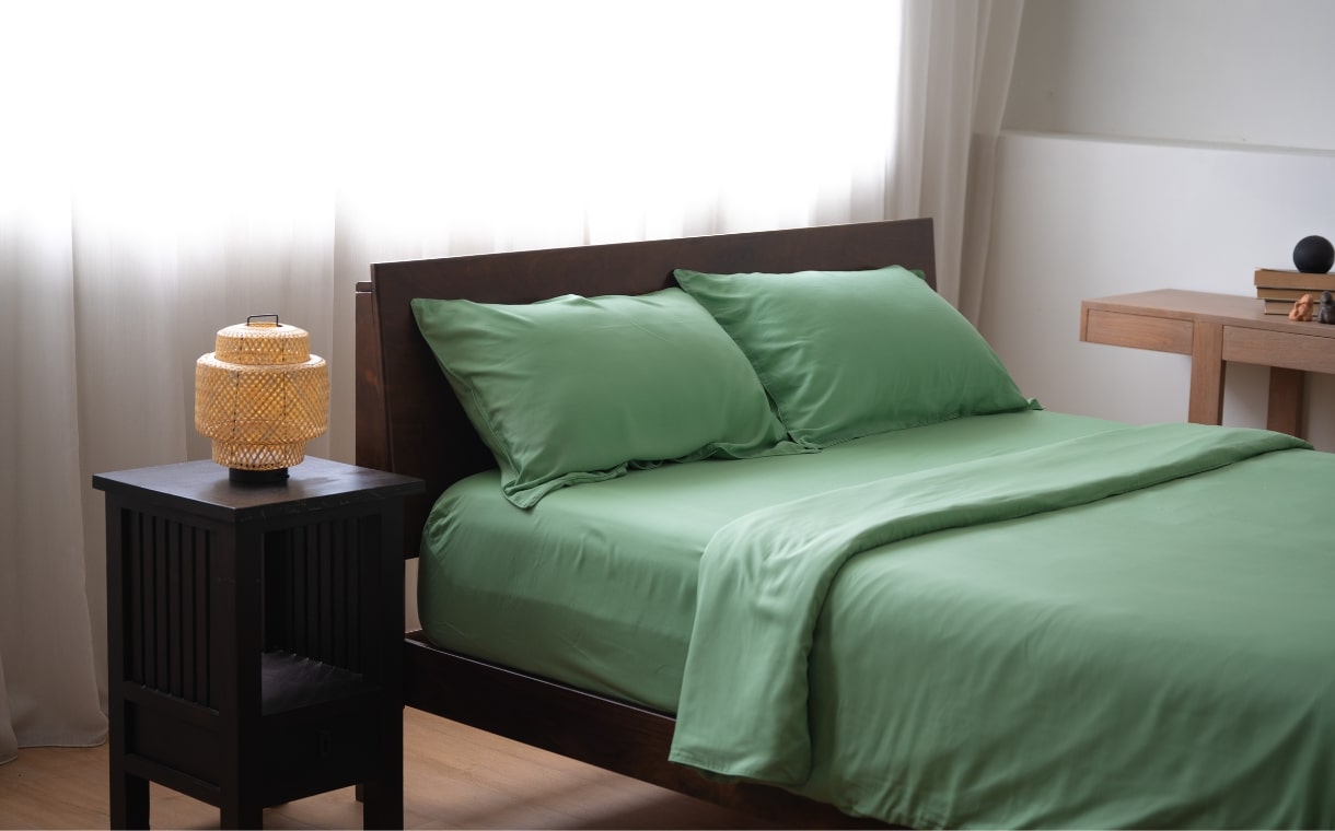 bedroom with Weavve's green TENCEL sheets