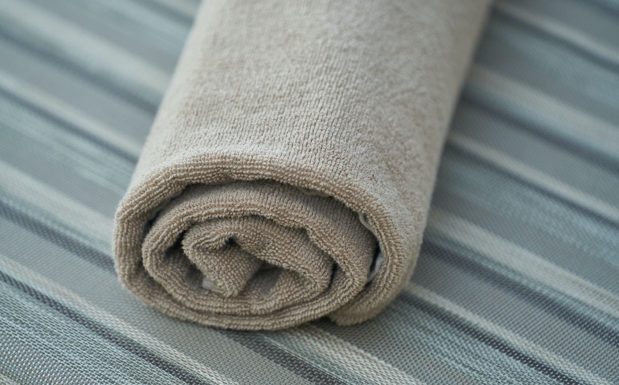 close up of rolled grey towel