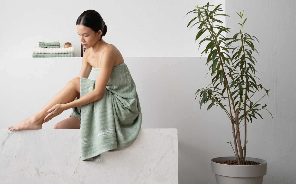 girl in green bamboo towel