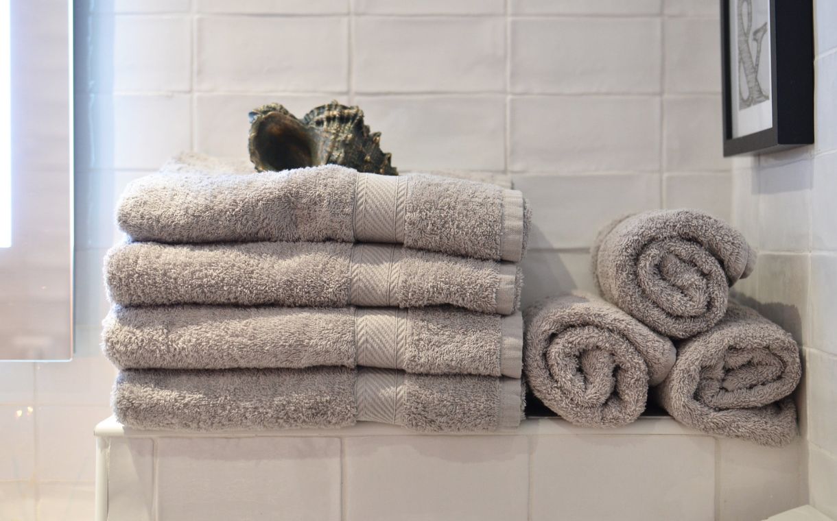 stack of towels in minimalist bathroom