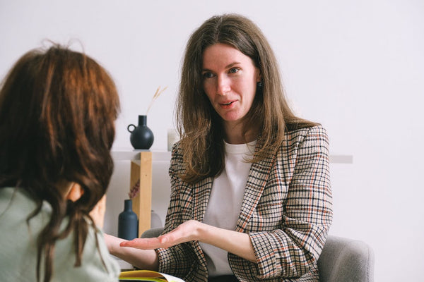 therapist speaking with a female patient