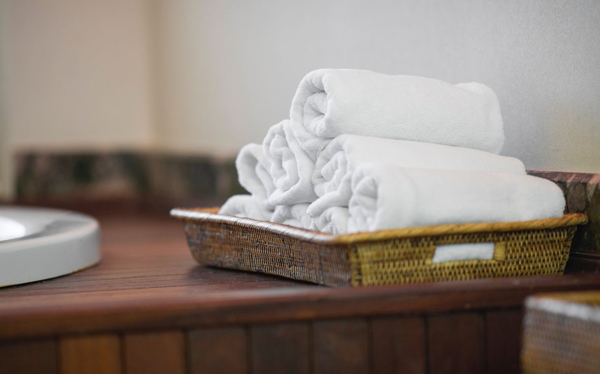 white towels on brown woven basket