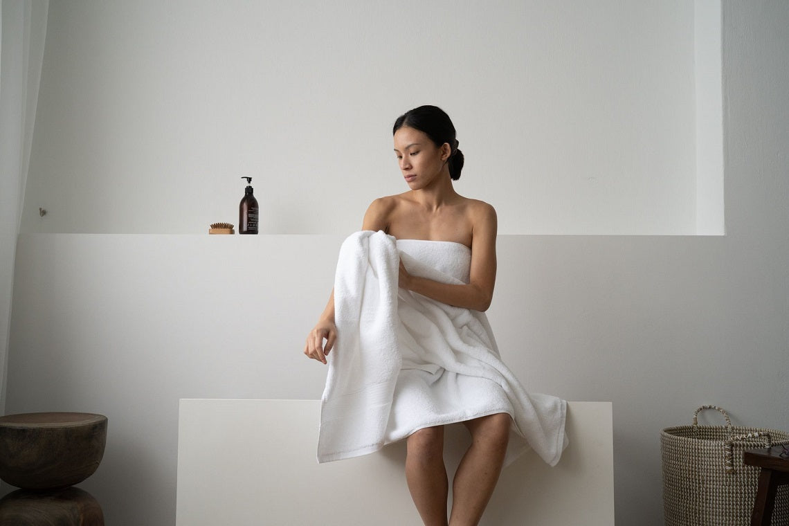 woman wrapped in silver-infused cotton towel