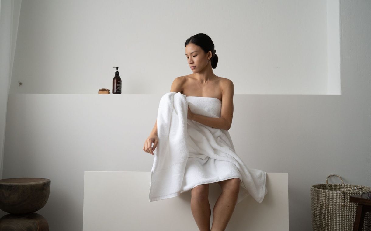 woman wrapped in silver infused bath towel