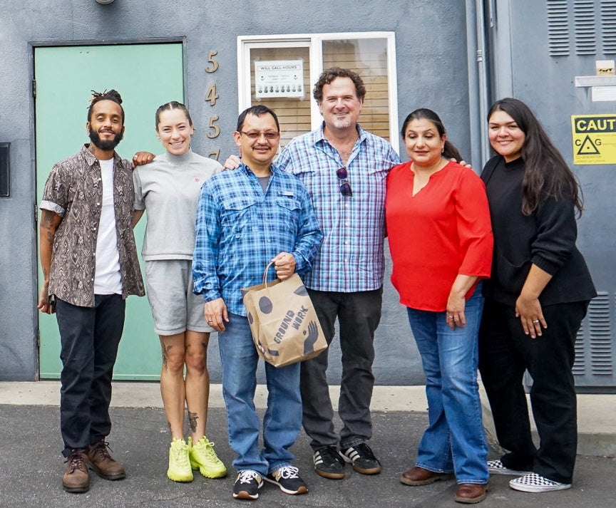Four Groundwork employees and two visitors from Guatemala in front of Groundwork headquarters