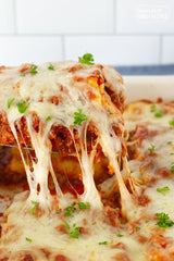 These Lasagna Roll Ups are just like regular lasagna except you spread meat sauce and cheese filling on each noodle and then roll them up! It makes perfect individual portions that are easy to serve. 