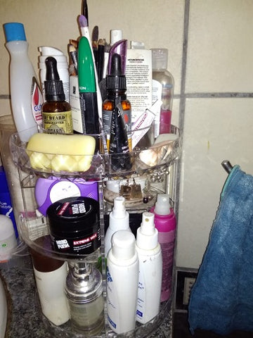 clear rotating cosmetic organiser filled with creams and makup