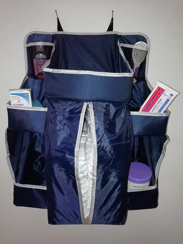 navy nursery organiser filled with accessories front view