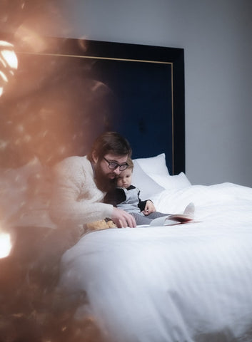 Dad Reading to Baby