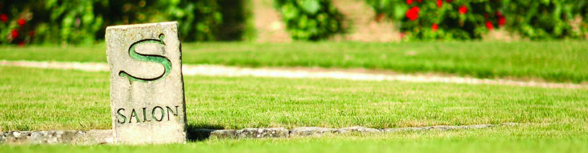 Champagne Salon Marker Stone on Grass Verge