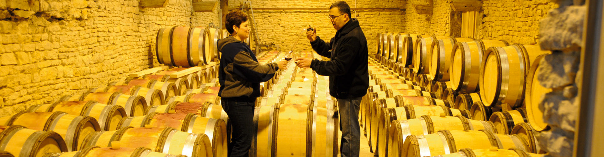 Mounir Saouma and his wife Rotem Brakin sampling in the barrel cellar