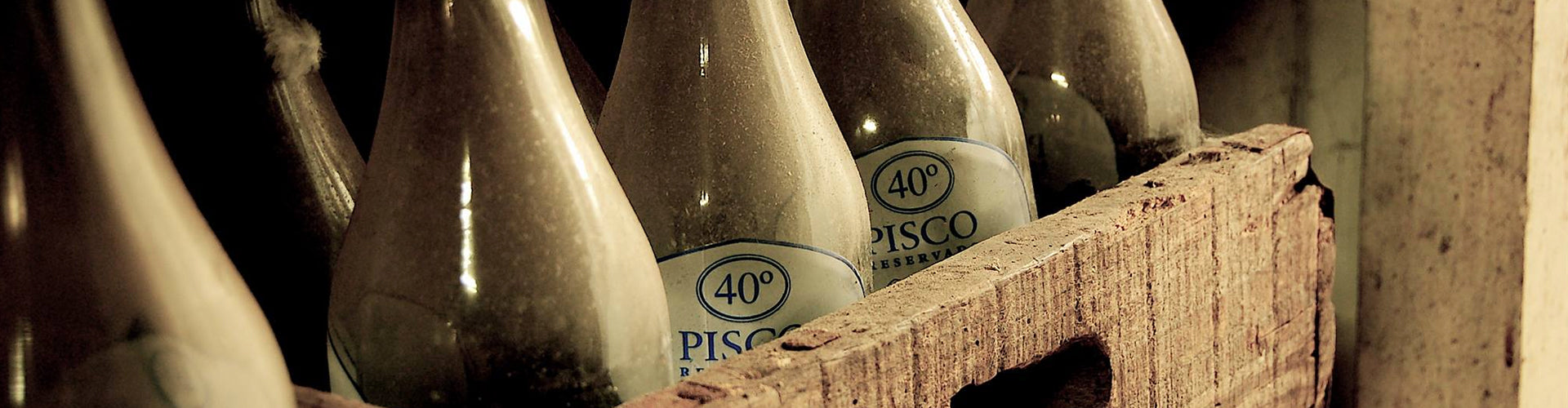 Antique Pisco Bottles in Cellar
