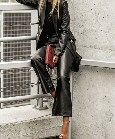 High waisted black leather pants with gold buttons 