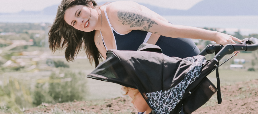 women in maternity activewear with baby in mountain buggy