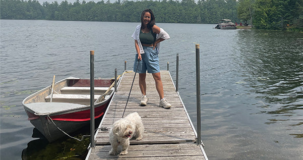 nini and bear on boat dock at family cottage