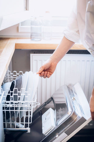 Clean dishes in dishwasher