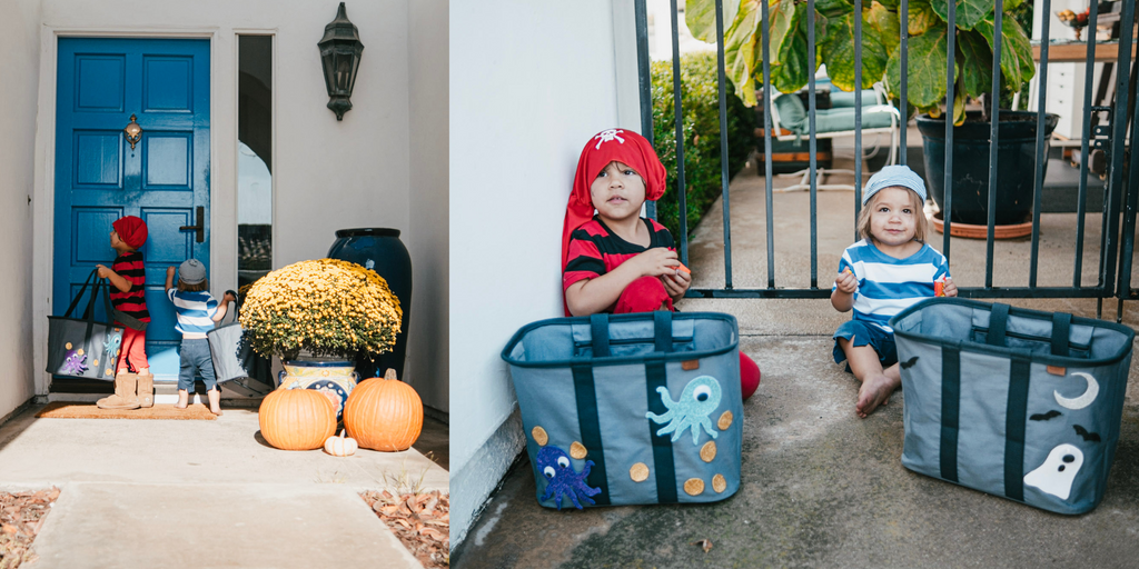 Little kids dressed as pirates trick or treating with decorated tote bags for candy