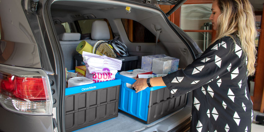 Collapsible storage bins in the trunk of the car filled with groceries