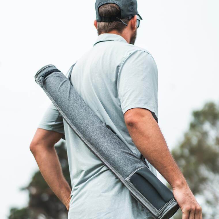 Man carrying a Sixer Sling over his shoulder