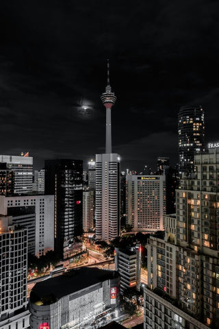 KL Tower standing tall under the night sky. Photo by Aqqib Maula.