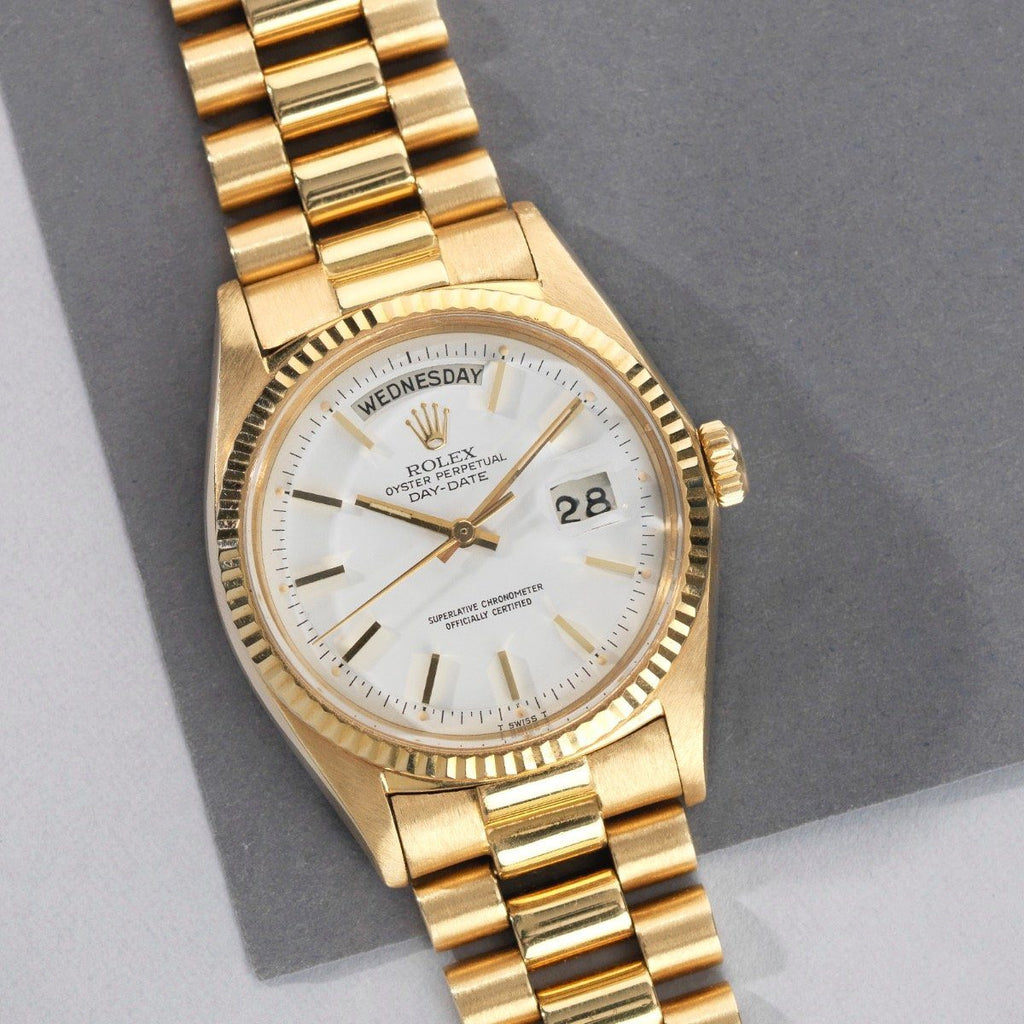 gold rolex day date white face