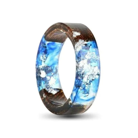 transparent resin ring with wood and blue foil inlay