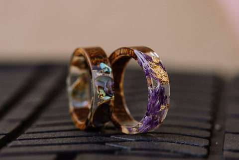 Two Transparent resin rings with various inlays