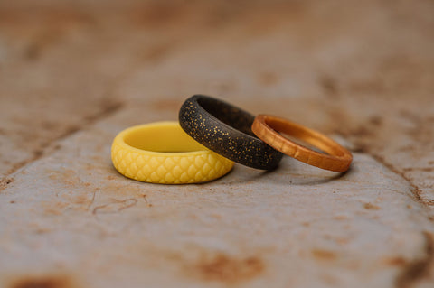 yellow, black and orange silicone rings