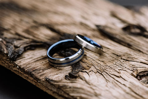 His and hers matching silver tungsten rings with blue inner