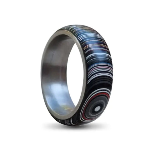 Titanium Ring with Fordite Outer on White Backdrop