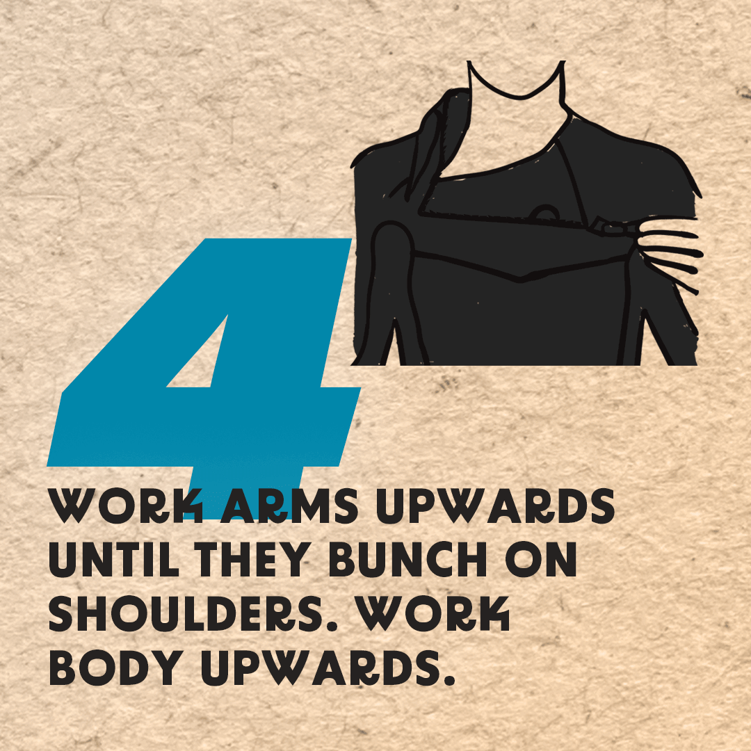 Step 4: Work Your Arms Upwards until they Bunch on your Shoulders. Work the body of the wetsuit upwards