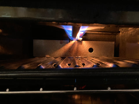 preheating gas broiler with broiler pan in position