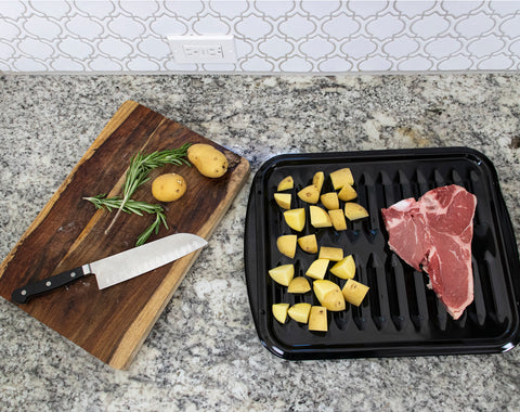 steak and potatoes on Certified Appliance Accessories broiler pan