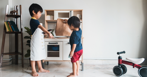 children playing pretend kitchen