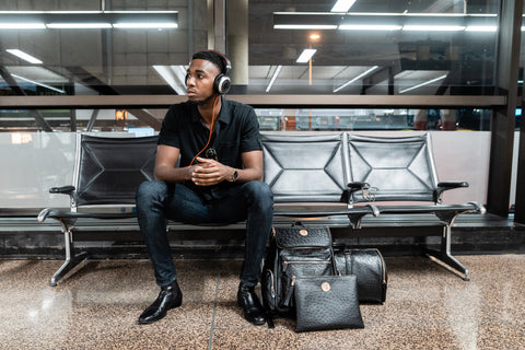 Adoni is a black owned designer brand producing fashion tracksuits and casual apparel, leather duffle bag luggage sets and purses in ostrich and python.